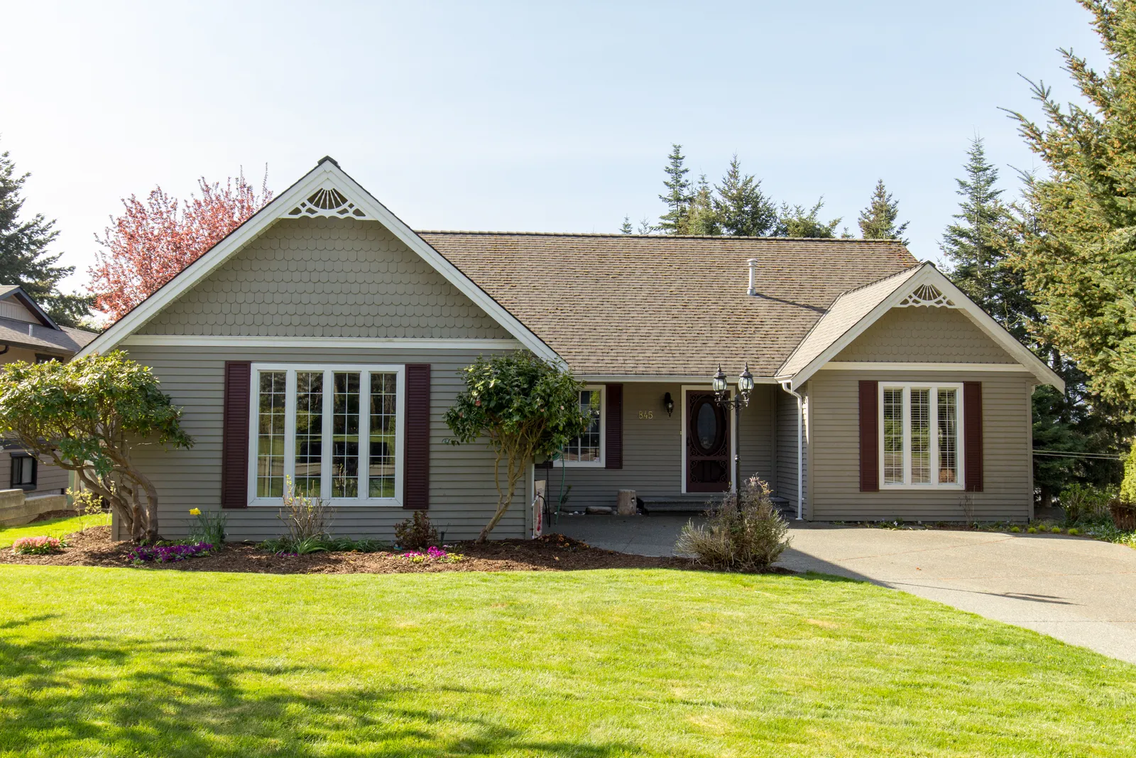 Brown shingle roof and decorative gable trim on a single-story home